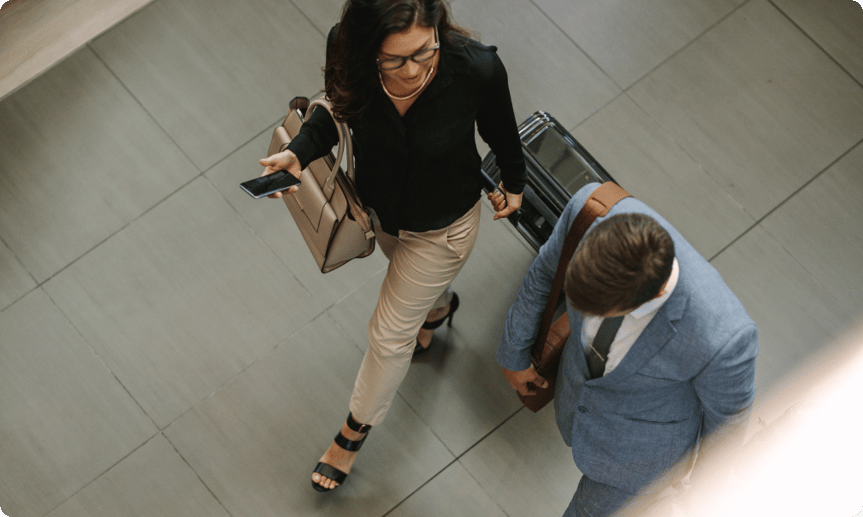 business travelers walking with luggage